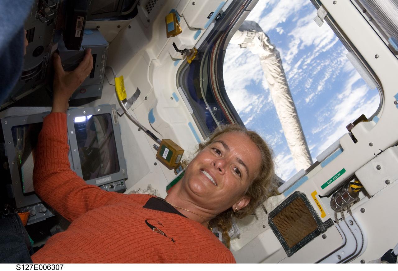 S127-E-006307 (16 July 2009) --- Canadian Space Agency astronaut Julie Payette, STS-127 mission specialist, is pictured on the aft flight deck of Space Shuttle Endeavour during flight day two activities.