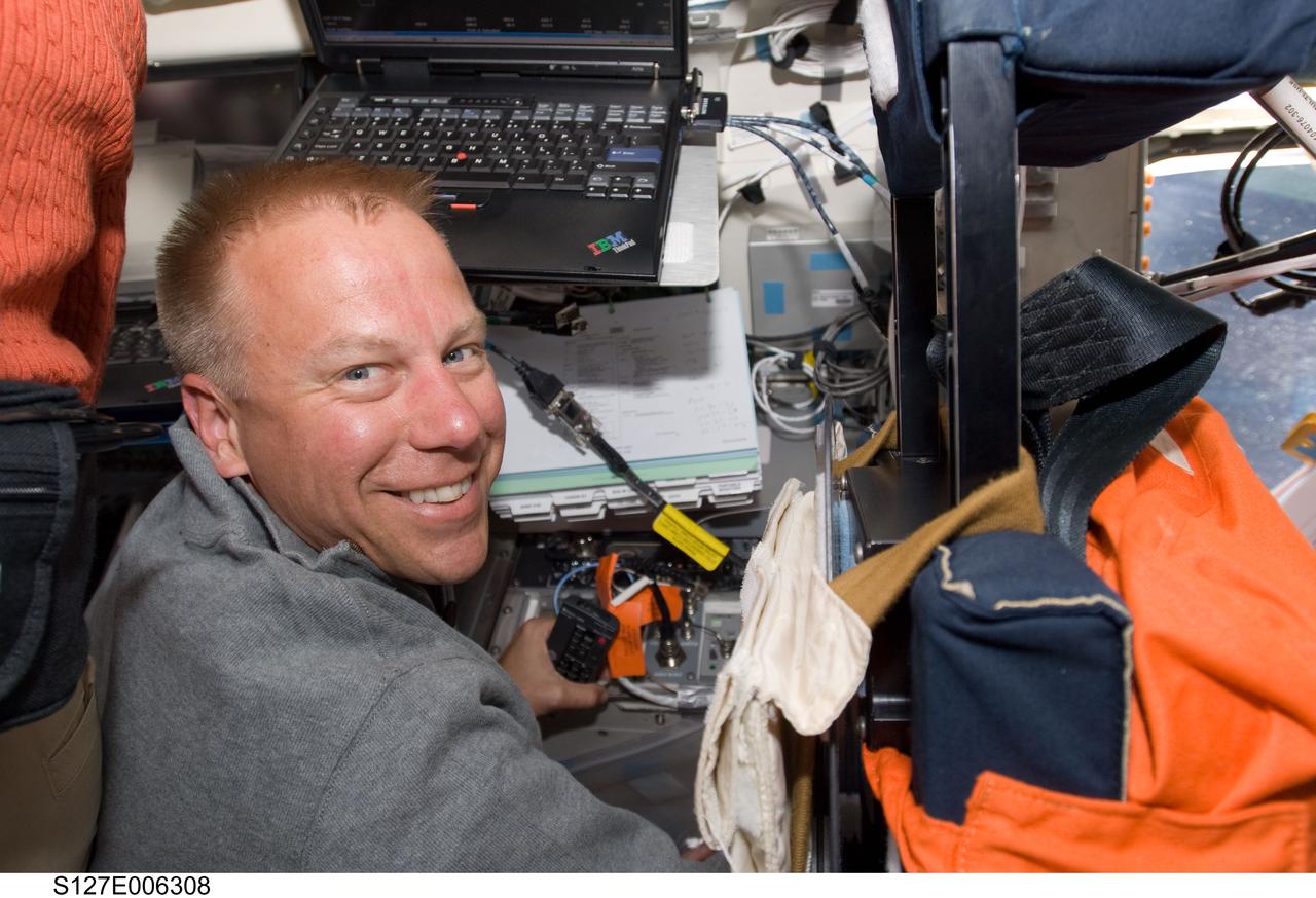 S127-E-006308 (16 July 2009) --- Astronaut Tim Kopra, STS-127 mission specialist, is pictured on the aft flight deck of Space Shuttle Endeavour during flight day two activities.