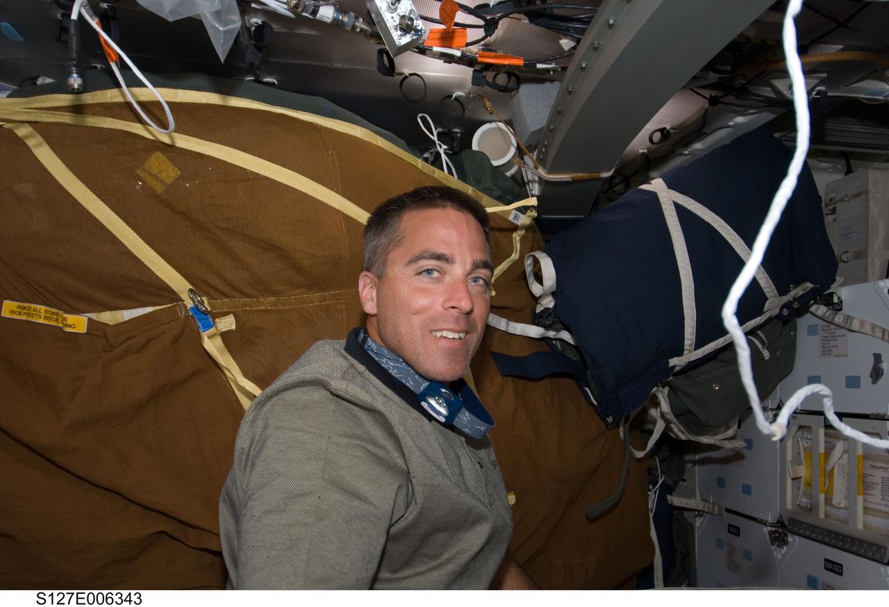 S127-E-006343 (16 July 2009) --- Astronaut Christopher Cassidy, STS-127 mission specialist, is pictured on the middeck of Space Shuttle Endeavour during flight day two activities.