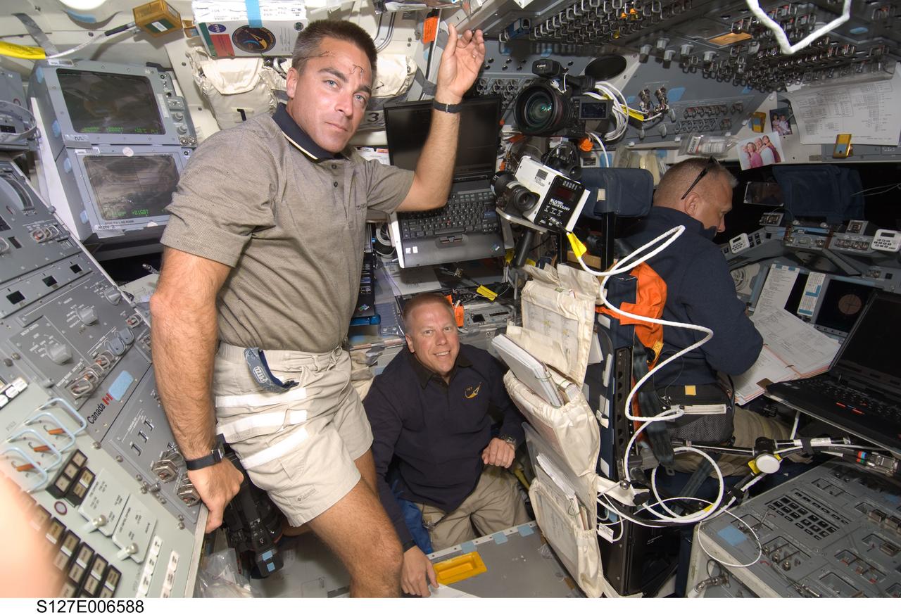S127-E-006588 (17 July 2009) --- From the left, astronauts Christopher Cassidy, Tim Kopra and Doug Hurley are pictured on the flight deck of the Space Shuttle Endeavour during flight day three activities.