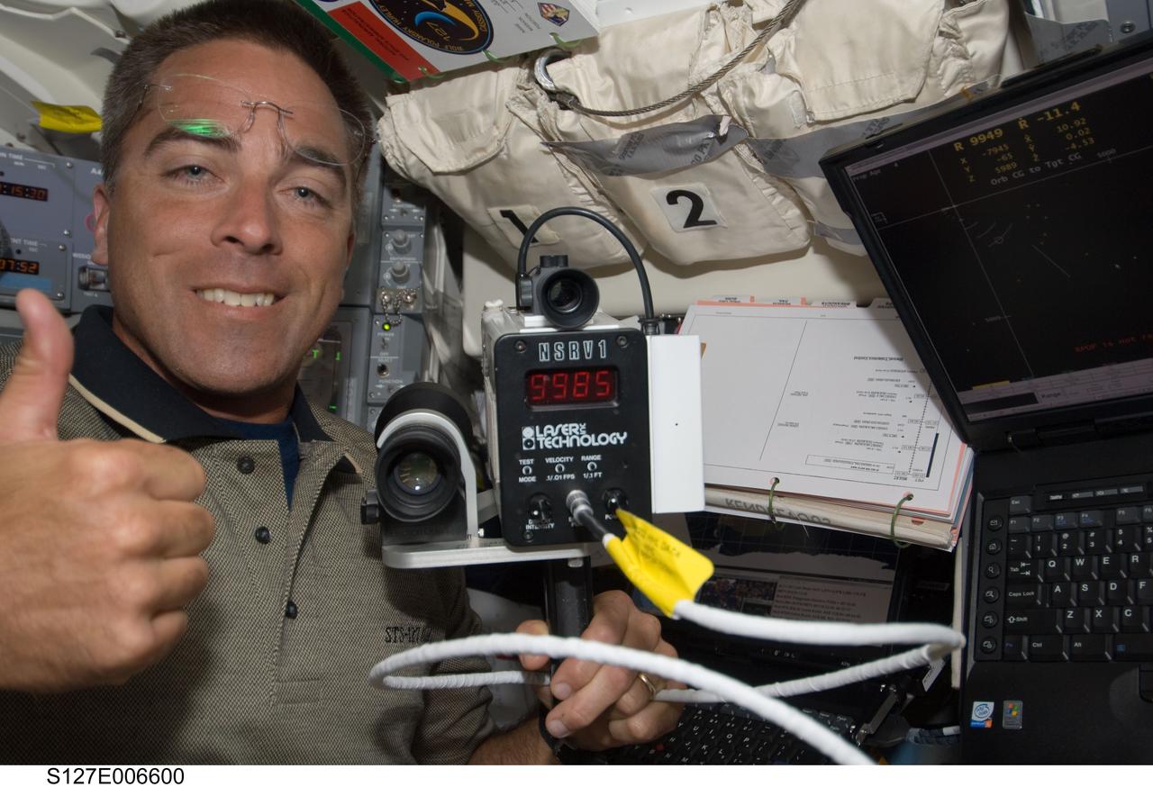 S127-E-006600 (17 July 2009) --- Astronaut Christopher Cassidy, STS-127 mission specialist, on Endeavour's flight deck during flight day three.