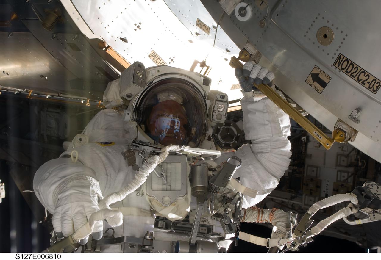 S127-E-006810 (18 July 2009) --- Astronaut Tim Kopra, mission specialist, is pictured during the first of five planned spacewalks to be performed on the International Space Station by the STS-127 crew. When the Endeavour crew returns to Earth, Kopra will stay onboard the station to serve as flight engineer for ISS expedition duty.