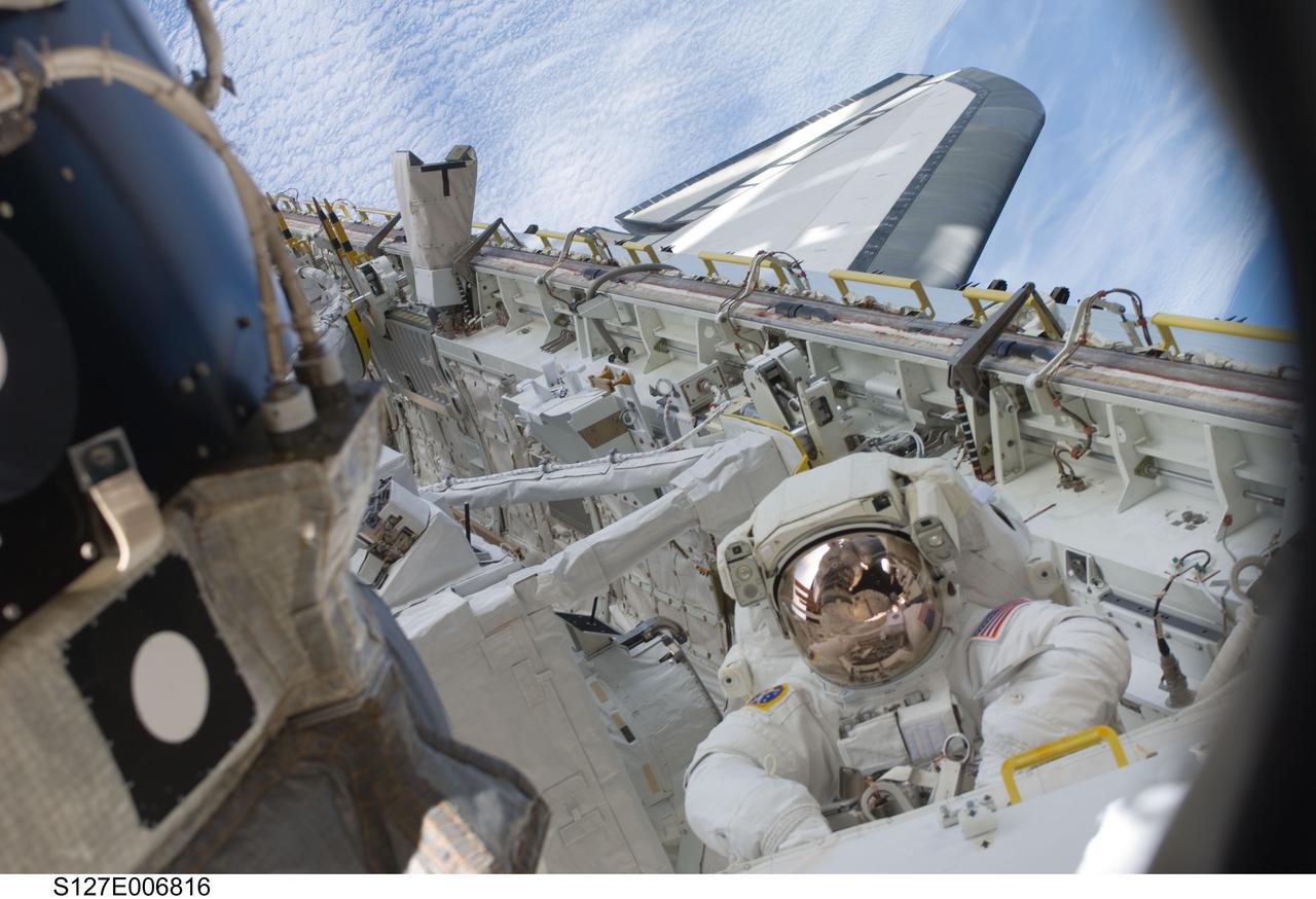 S127-E-006816 (18 July 2009) --- Astronaut Tim Kopra, mission specialist, is pictured in the forward port side area of Endeavour's cargo bay during the first of five planned spacewalks to be performed on the International Space Station by the STS-127 crew. When the Endeavour crew returns to Earth, Kopra will stay onboard the space station to serve as flight engineer for ISS expedition duty.