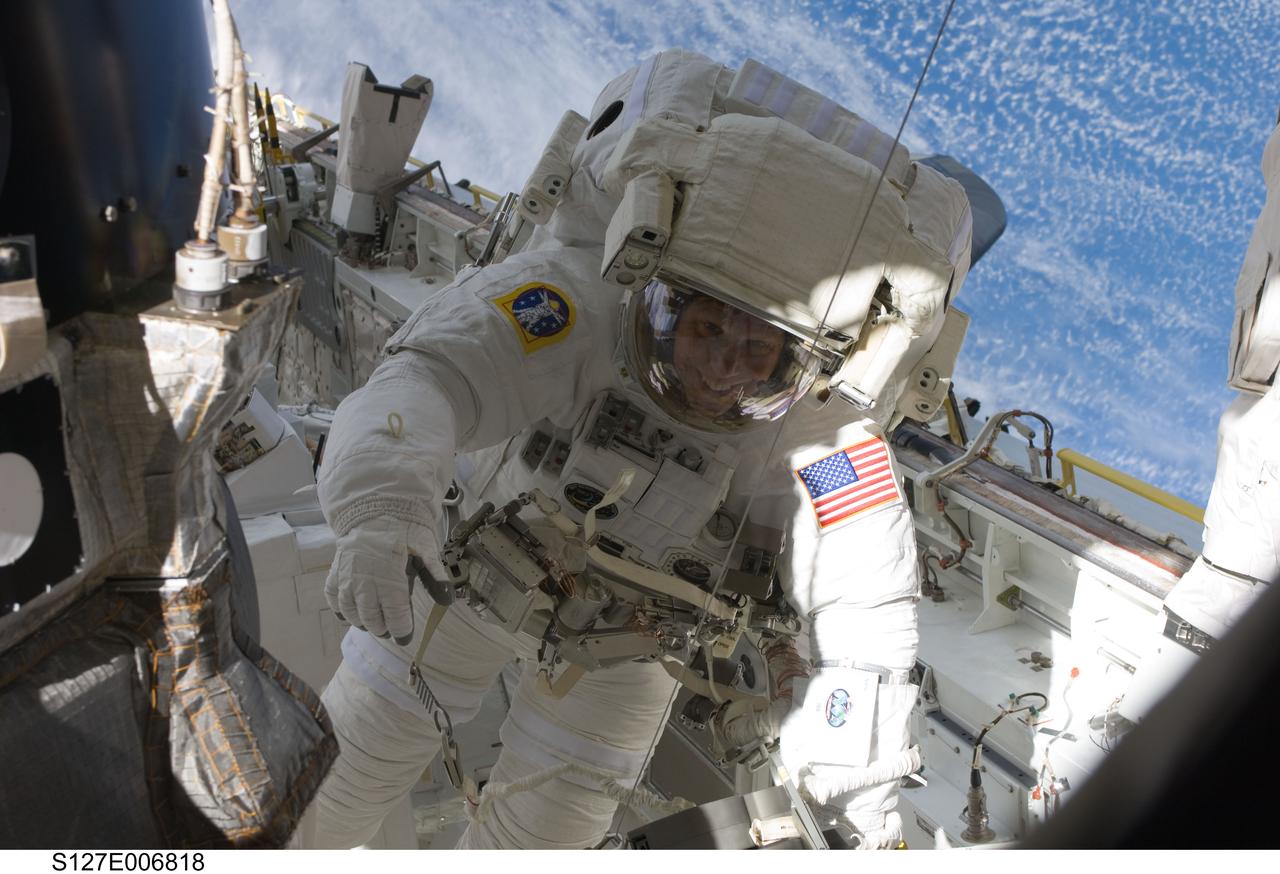 S127-E-006818 (18 July 2009) --- Astronaut Tim Kopra, mission specialist, is pictured in Endeavour's cargo bay during the first of five planned spacewalks to be performed on the International Space Station by the STS-127 crew. When the Endeavour crew returns to Earth, Kopra will stay onboard to serve as flight engineer for ISS expedition duty.