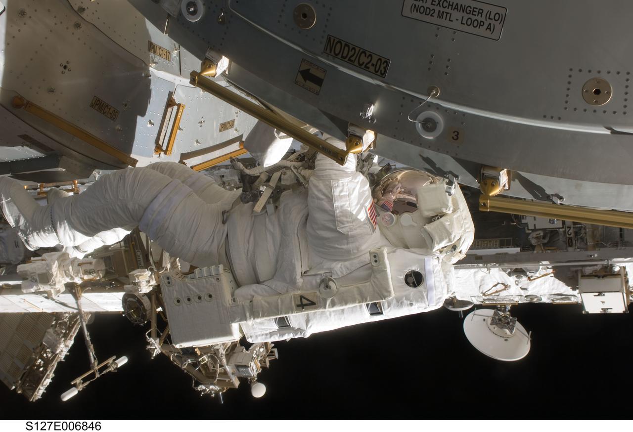 S127-E-006846 (18 July 2009) --- Astronaut Tim Kopra, mission specialist, is pictured during the first of five planned spacewalks to be performed on the International Space Station by the STS-127 crew. Kopra, joined by astronaut Dave Wolf (out of frame) on this spacewalk, holds onto a handrail on Harmony or U.S. Node 2. When the Endeavour crew returns to Earth, Kopra will stay onboard the station to serve as flight engineer for ISS expedition duty.