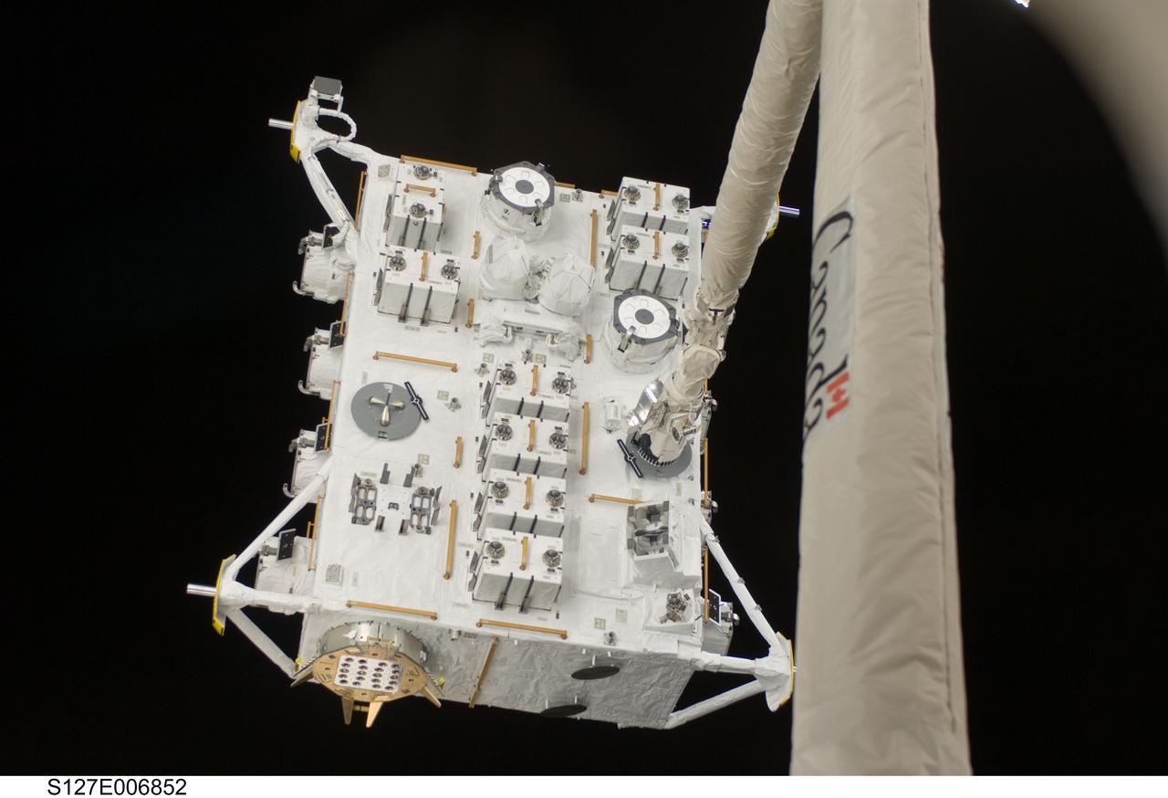 S127-E-006852 (18 July 2009) --- The Japanese Experiment Module - Exposed Facility (JEF) is pictured in the grasp of the Space Shuttle Endeavour's remote manipulator system (RMS) arm during flight day four robotics activity. Astronauts also began a series of five spacewalks on this day to continue work on the International Space Station.