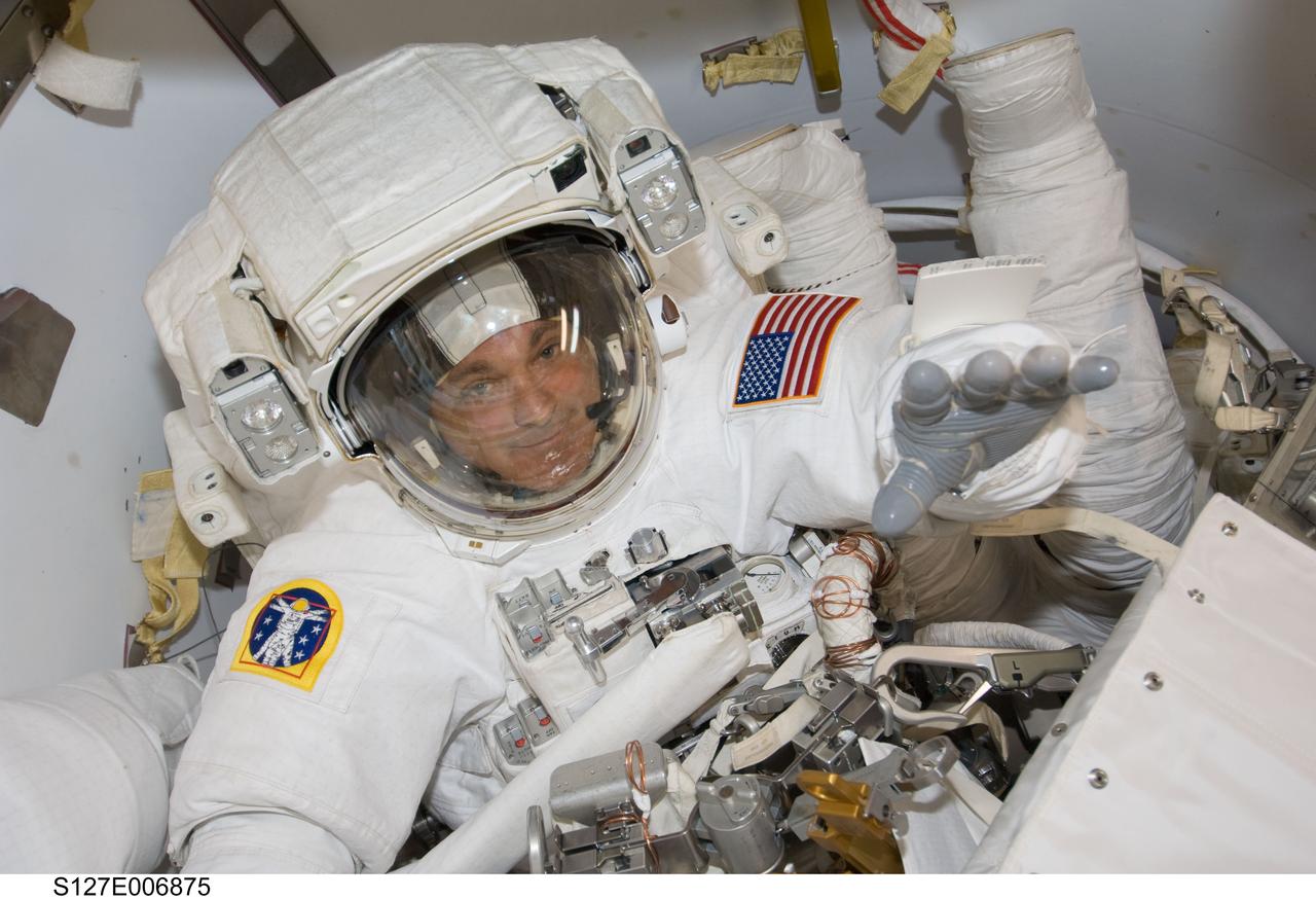 S127-E-006875 (18 July 2009) --- Astronaut Dave Wolf, mission specialist, on July 18 was one of two Endeavour astronauts to kick off a series of five sessions of ISS-related extravehicular activity for the STS-127 crew. Wolf, seen onboard the orbital outpost here, was joined by astronaut Tim Kopra for this session, his first of three scheduled.