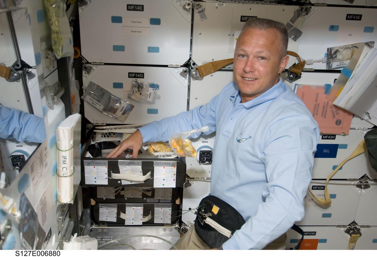 S127-E-006880 (18 July 2009) --- Astronaut Doug Hurley, STS-127 pilot, is pictured on the mid deck of the Space Shuttle Endeavour, the crew of which is in its second day of joint activities with the crewmembers onboard the International Space Station. This day is a spacewalk day, the first of five, and Hurley is assigned to intravehicular support for all five spacewalks.
