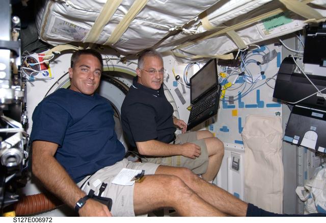 NASA image: Cassidy and Wolf in the MDDK during STS-127 / Expedition 20 Joint Operations