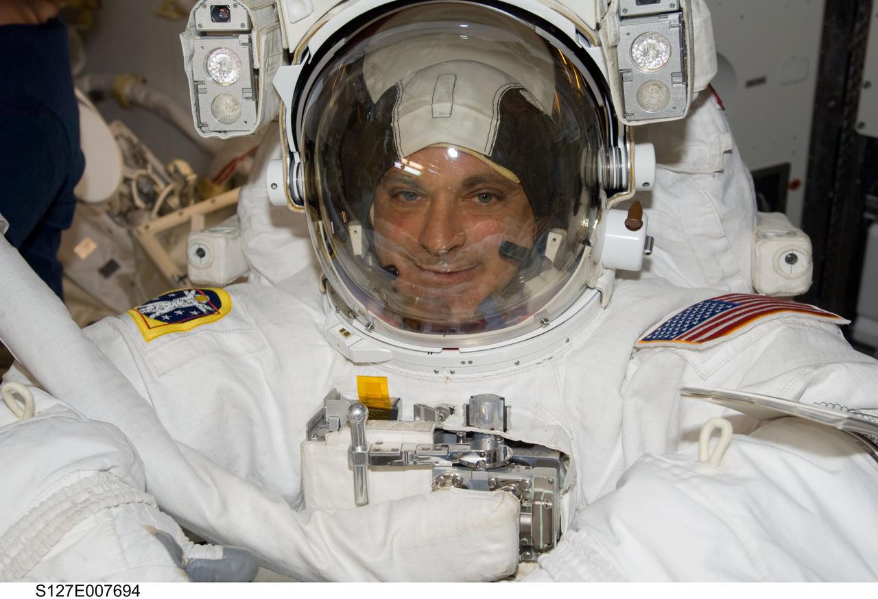 S127-E-007694 (22 July 2009) --- Astronaut Dave Wolf, STS-127 mission specialist, is just about ready to participate in Endeavour's third space walk of a scheduled five overall for this flight. He joined astronaut Christopher Cassidy STS-127 mission specialist, for the session.