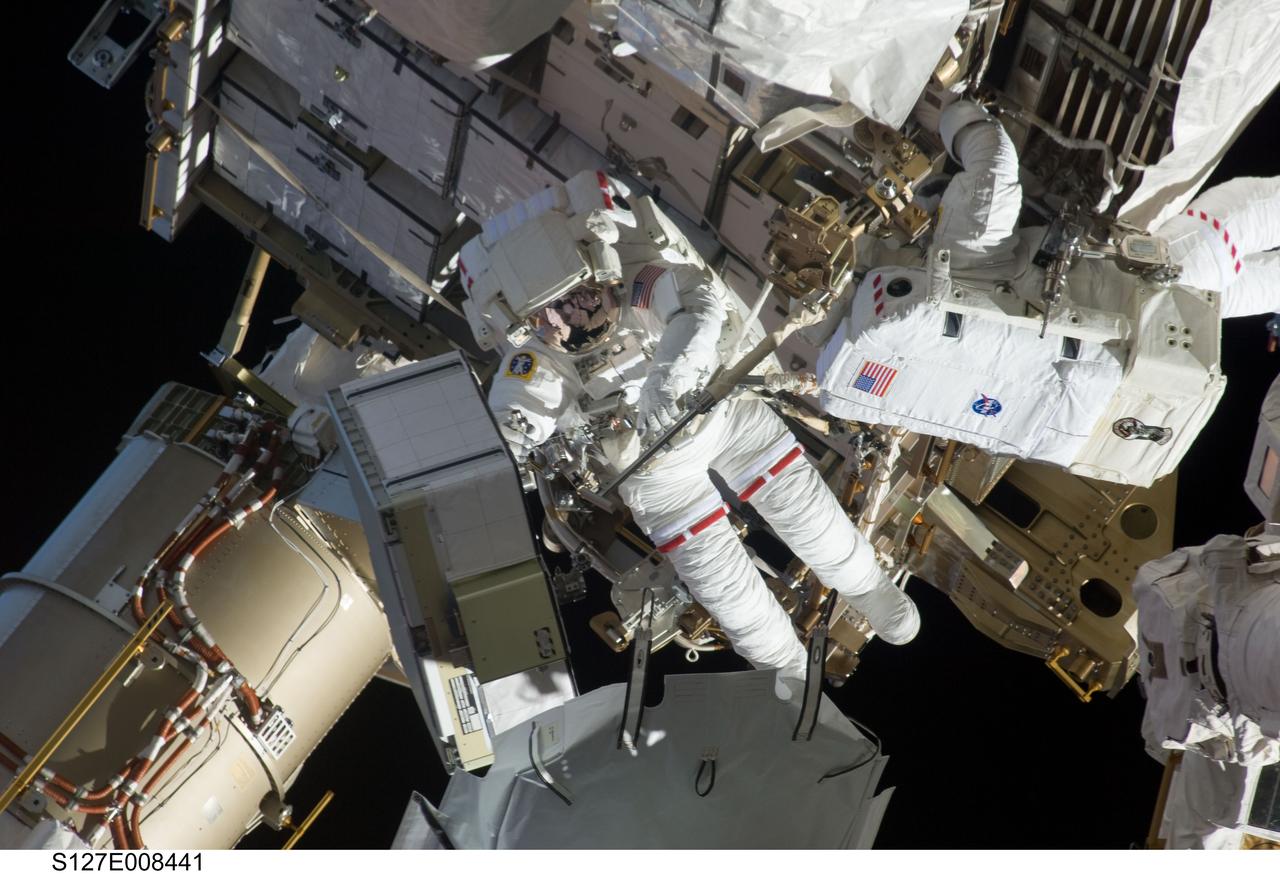 S127-E-008441 (24 July 2009) --- Astronauts Tom Marshburn (left) and Christopher Cassidy, mission specialists for STS-127, share duties on the fourth spacewalk of Endeavour's current mission and its crew's joint activities with the space station. Eleven astronauts and cosmonauts remained inside the International Space Station and the shuttle to which it was docked, while the two continued work on the orbital outpost. The two will team up for the mission's final spacewalk on July 27.