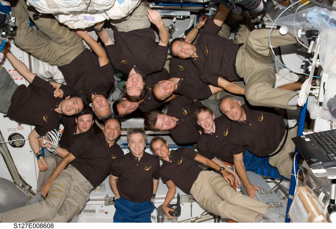 S127-E-008608 (25 July 2009) --- A record-setting 13  astronauts and cosmonauts assemble for a shuttle-station group photo on the orbital outpost.  The STS-127 Endeavour crew includes  astronauts Mark Polansky, Doug Hurley, Christopher Cassidy, Tom Marshburn and Dave Wolf along with Japanese Aerospace Exploration Agency astronaut Koichi Wakata and Canadian Space Agency astronaut Julie Payette.  The station crew members are Russian Federal Space Agency cosmonauts Gennady Padalka and Roman Romanenko, Canadian Space Agency astronaut Robert Thirsk, European Space Agency astronaut Frank DeWinne and astronauts Mike Barratt and Tim Kopra.