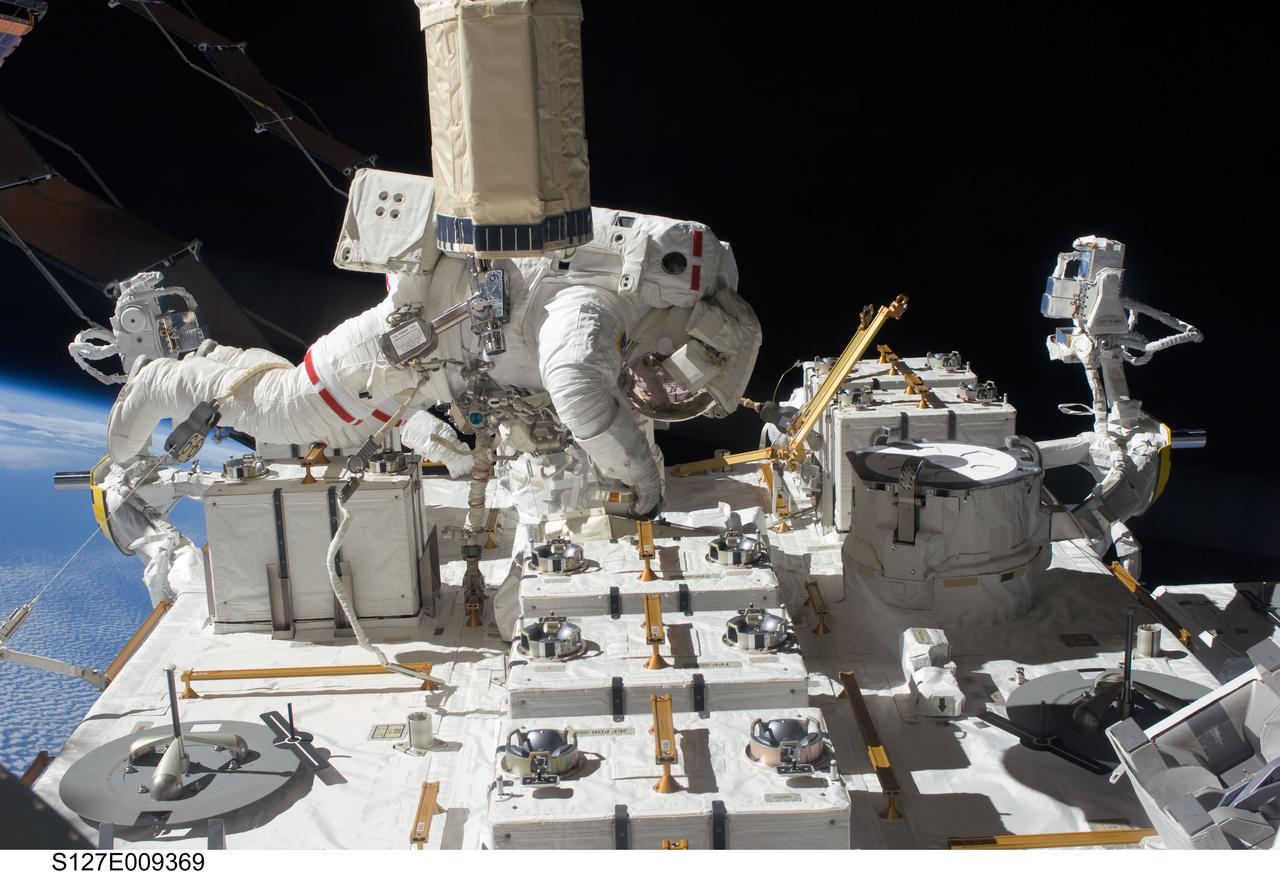 S127-E-009369 (27 July 2009) --- Astronaut Tom Marshburn, STS-127 mission specialist, participates in the mission's fifth and final session of extravehicular activity (EVA) as construction and maintenance continue on the International Space Station. During the four-hour, 54-minute spacewalk, Marshburn and astronaut Christopher Cassidy (out of frame), mission specialist, secured multi-layer insulation around the Special Purpose Dexterous Manipulator known as Dextre, split out power channels for two space station Control Moment Gyroscopes, installed video cameras on the front and back of the new Japanese Exposed Facility and performed a number of “get ahead” tasks, including tying down some cables and installing handrails and a portable foot restraint to aid future spacewalkers.