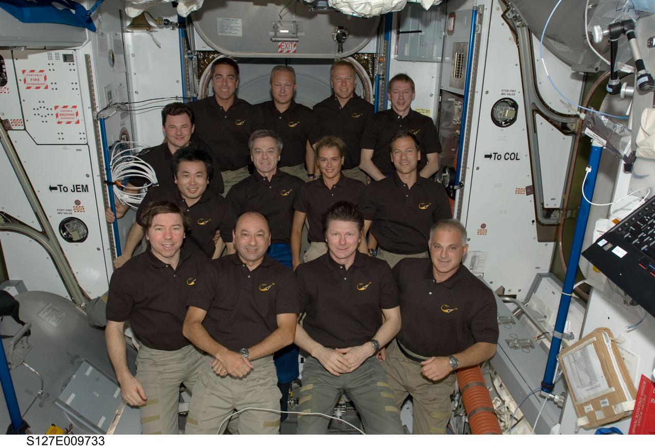 S127-E-009733 (28 July 2009) --- The STS-127 and Expedition 20 crew members pose for a group portrait in the Harmony node of the International Space Station while the Space Shuttle Endeavour remains docked with the station. Pictured from the left (front row) are NASA astronauts Michael Barratt, Expedition 20 flight engineer; Mark Polansky, STS-127 commander; cosmonaut Gennady Padalka, Expedition 20 commander; and NASA astronaut Dave Wolf, STS-127 mission specialist. Pictured from the left (middle row) are Japan Aerospace Exploration Agency (JAXA) astronaut Koichi Wakata, STS-127 mission specialist; Canadian Space Agency astronauts Julie Payette, STS-127 mission specialist; and Robert Thirsk, Expedition 20 flight engineer; and NASA astronaut Tom Marshburn, STS-127 mission specialist. Pictured from the left (back row) are cosmonaut Roman Romanenko, Expedition 20 flight engineer; NASA astronauts Christopher Cassidy, STS-127 mission specialist; Doug Hurley, STS-127 pilot; Tim Kopra, Expedition 20 flight engineer; and European Space Agency astronaut Frank De Winne, Expedition 20 flight engineer.