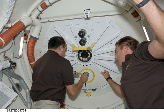 NASA image: Polansky and Cassidy in the A/L of Endeavour