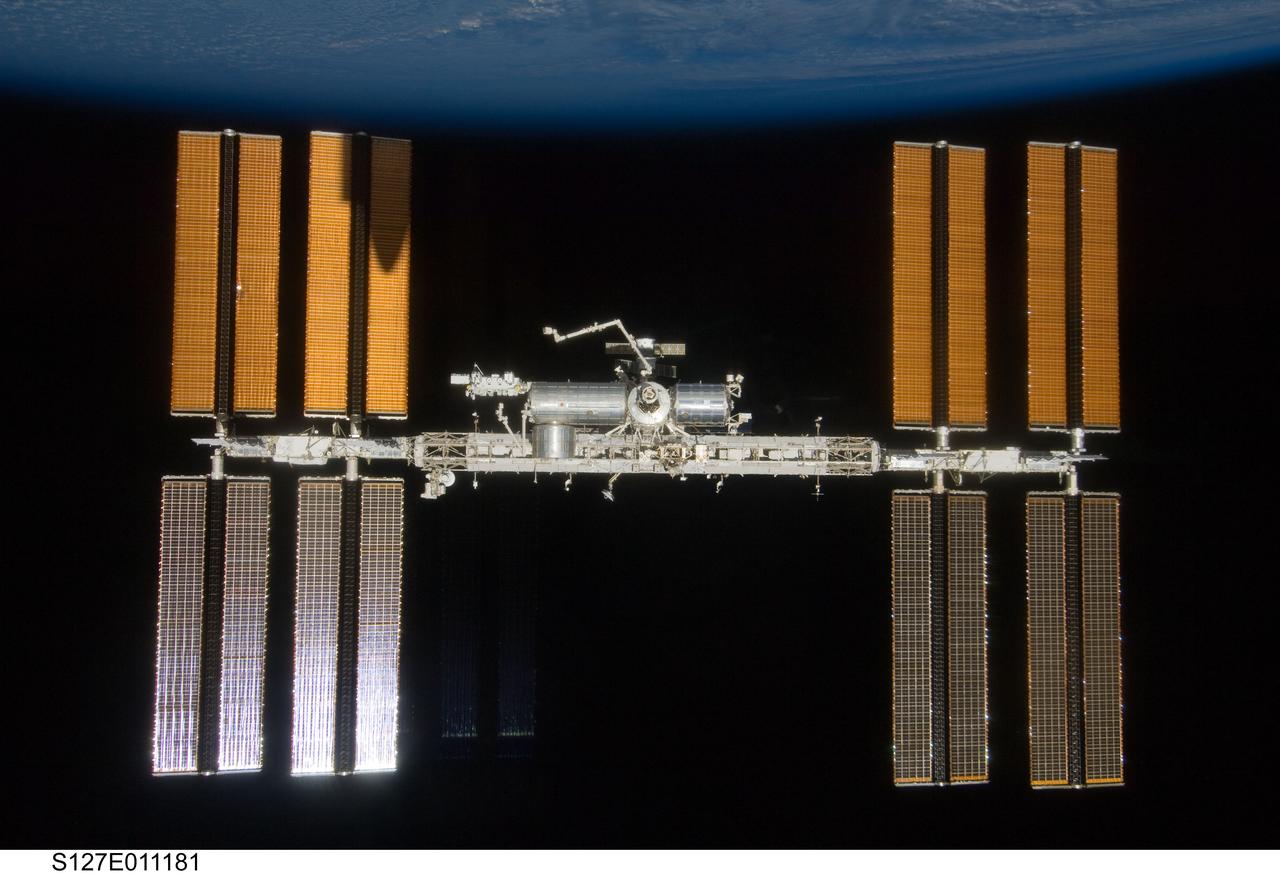 S127-E-011181 (28 July 2009) --- Backdropped by the blackness of space and Earth’s horizon, the International Space Station is seen from Space Shuttle Endeavour as the two spacecraft begin their relative separation. Earlier the STS-127 and Expedition 20 crews concluded 11 days of cooperative work onboard the shuttle and station. Undocking of the two spacecraft occurred at 12:26 p.m. (CDT) on July 28, 2009. A partial shadow of Endeavour is visible on the solar array wing panels.