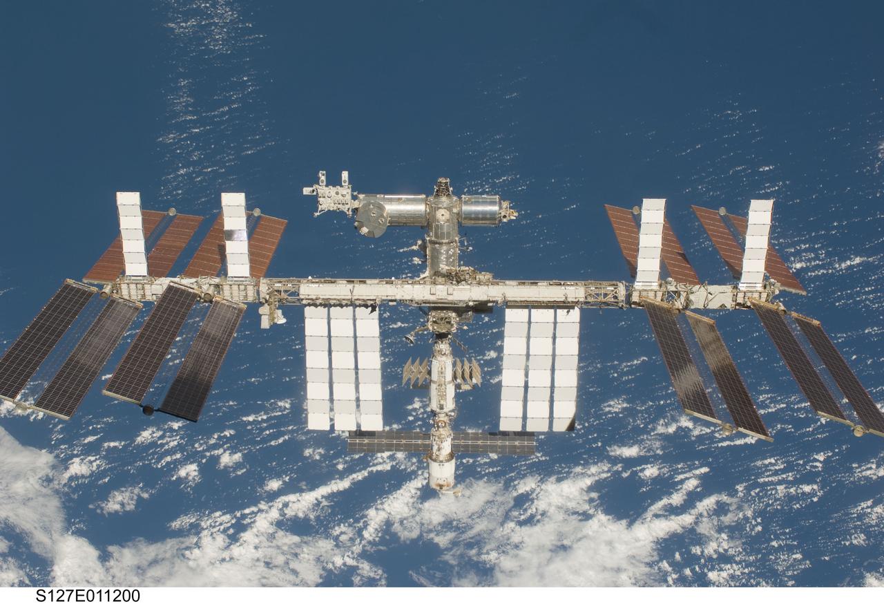 S127-E-011200 (28 July 2009) --- Backdropped by a blue and white Earth, the International Space Station is seen from Space Shuttle Endeavour as the two spacecraft begin their relative separation. Earlier the STS-127 and Expedition 20 crews concluded 11 days of cooperative work onboard the shuttle and station. Undocking of the two spacecraft occurred at 12:26 p.m. (CDT) on July 28, 2009.