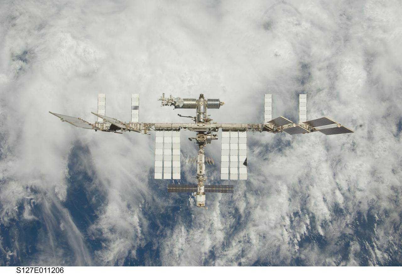 S127-E-011206 (28 July 2009) --- Backdropped by a blue and white Earth, the International Space Station is seen from Space Shuttle Endeavour as the two spacecraft begin their relative separation. Earlier the STS-127 and Expedition 20 crews concluded 11 days of cooperative work onboard the shuttle and station. Undocking of the two spacecraft occurred at 12:26 p.m. (CDT) on July 28, 2009.