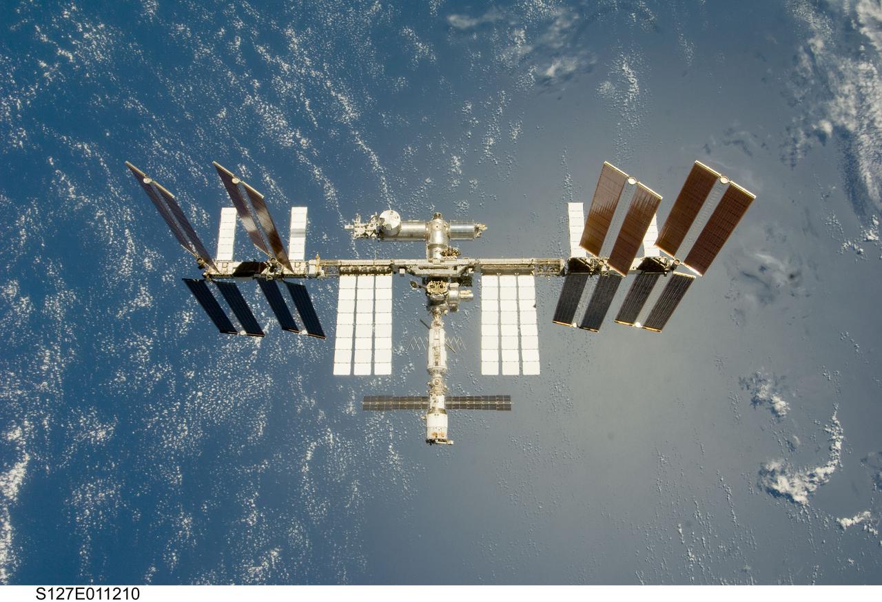 S127-E-011210 (28 July 2009) --- Backdropped by a blue and white Earth, the International Space Station is seen from Space Shuttle Endeavour as the two spacecraft begin their relative separation. Earlier the STS-127 and Expedition 20 crews concluded 11 days of cooperative work onboard the shuttle and station. Undocking of the two spacecraft occurred at 12:26 p.m. (CDT) on July 28, 2009.