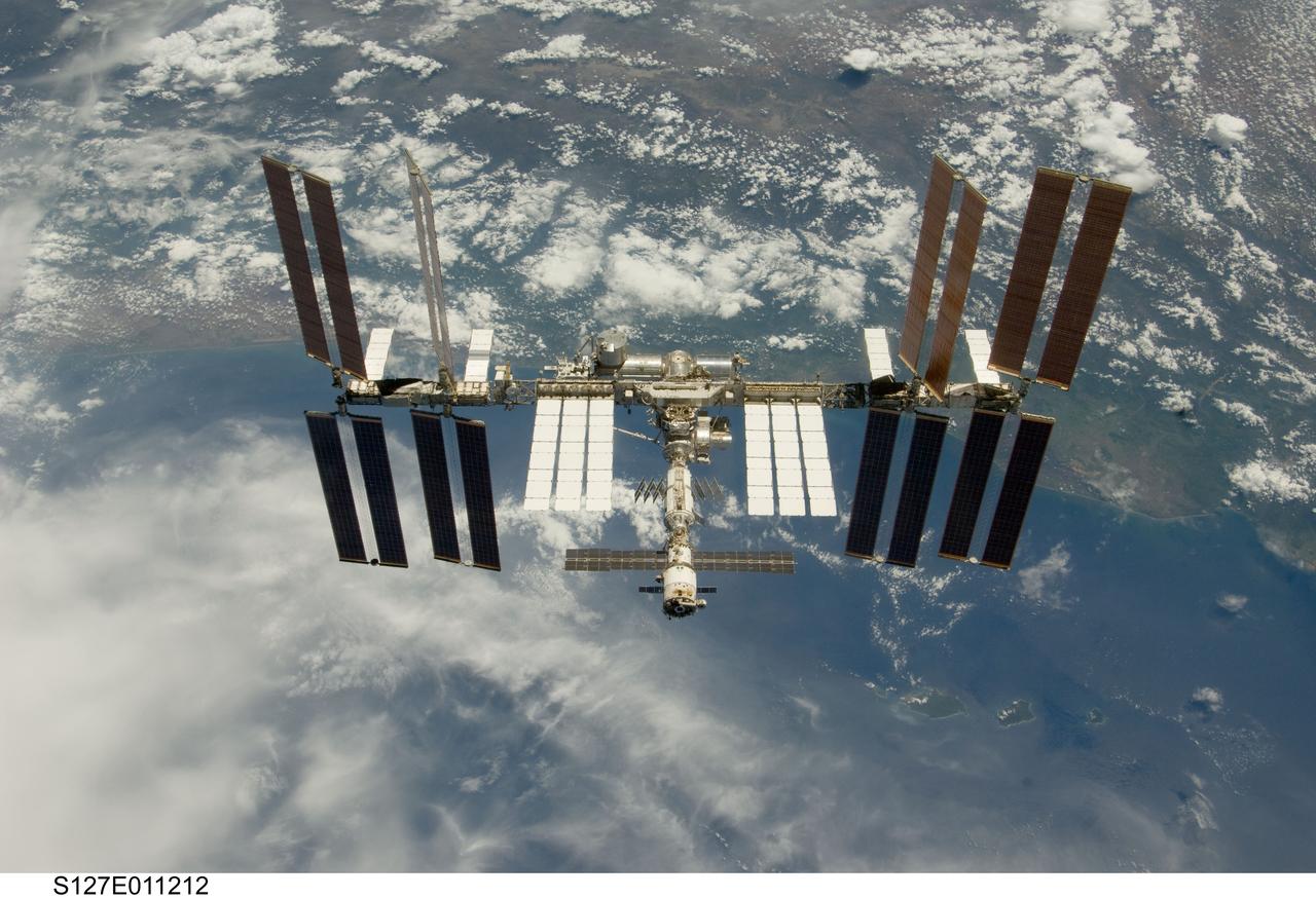 S127-E-011212 (28 July 2009) --- Backdropped by a blue and white Earth, the International Space Station is seen from Space Shuttle Endeavour as the two spacecraft begin their relative separation. Earlier the STS-127 and Expedition 20 crews concluded 11 days of cooperative work onboard the shuttle and station. Undocking of the two spacecraft occurred at 12:26 p.m. (CDT) on July 28, 2009.