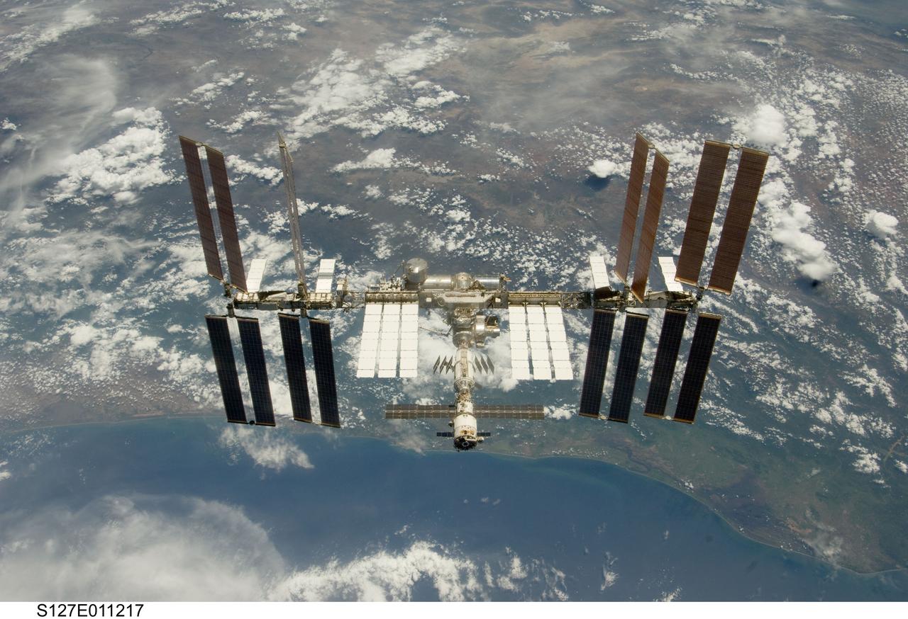 S127-E-011217 (28 July 2009) --- Backdropped by a blue and white Earth, the International Space Station is seen from Space Shuttle Endeavour as the two spacecraft begin their relative separation. Earlier the STS-127 and Expedition 20 crews concluded 11 days of cooperative work onboard the shuttle and station. Undocking of the two spacecraft occurred at 12:26 p.m. (CDT) on July 28, 2009.