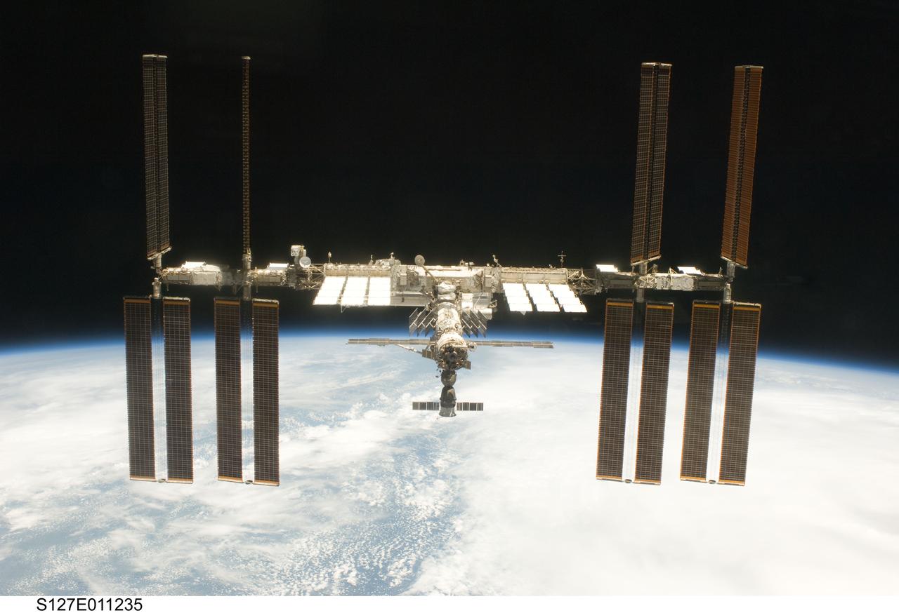 S127-E-011235 (28 July 2009) --- Backdropped by Earth’s horizon and the blackness of space, the International Space Station is seen from Space Shuttle Endeavour as the two spacecraft begin their relative separation. Earlier the STS-127 and Expedition 20 crews concluded 11 days of cooperative work onboard the shuttle and station. Undocking of the two spacecraft occurred at 12:26 p.m. (CDT) on July 28, 2009.