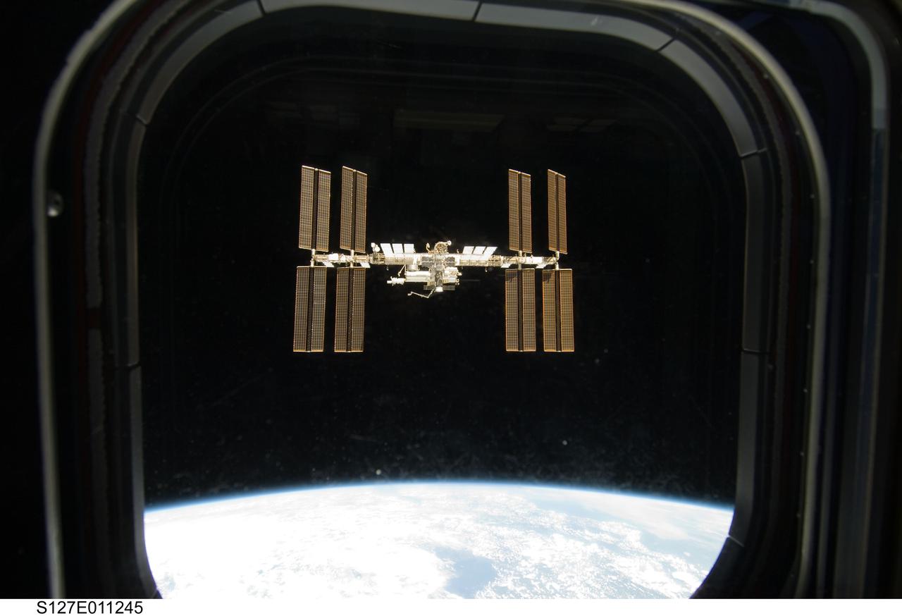 S127-E-011245 (28 July 2009) --- Framed by a window on Space Shuttle Endeavour, the International Space Station is seen from the shuttle as the two spacecraft begin their relative separation. Earlier the STS-127 and Expedition 20 crews concluded 11 days of cooperative work onboard the shuttle and station. Undocking of the two spacecraft occurred at 12:26 p.m. (CDT) on July 28, 2009.