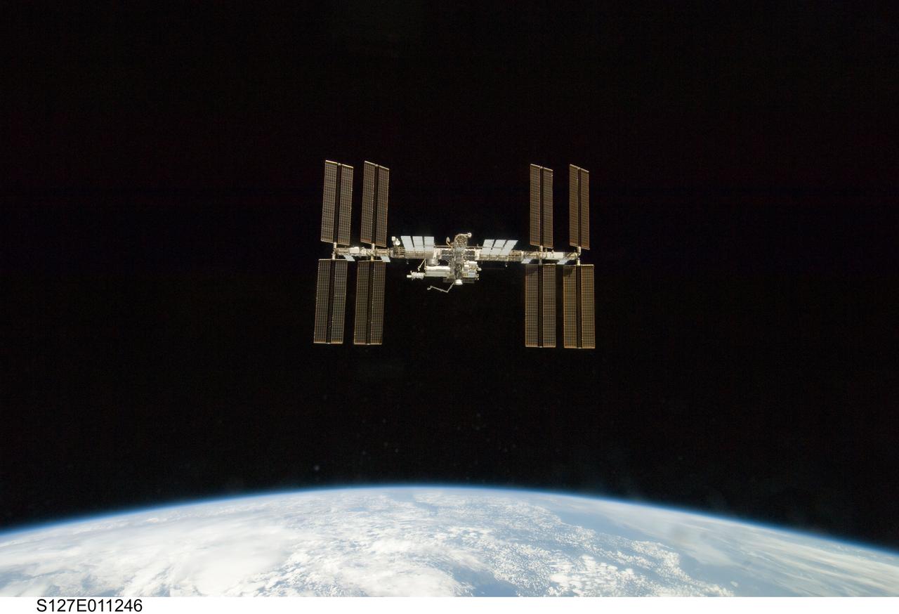 S127-E-011246 (28 July 2009) --- Backdropped by Earth’s horizon and the blackness of space, the International Space Station is seen from Space Shuttle Endeavour as the two spacecraft begin their relative separation. Earlier the STS-127 and Expedition 20 crews concluded 11 days of cooperative work onboard the shuttle and station. Undocking of the two spacecraft occurred at 12:26 p.m. (CDT) on July 28, 2009.