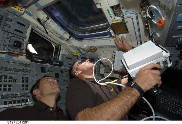 NASA image: Cassidy holds laser range finder in aft FD during Joint Operations