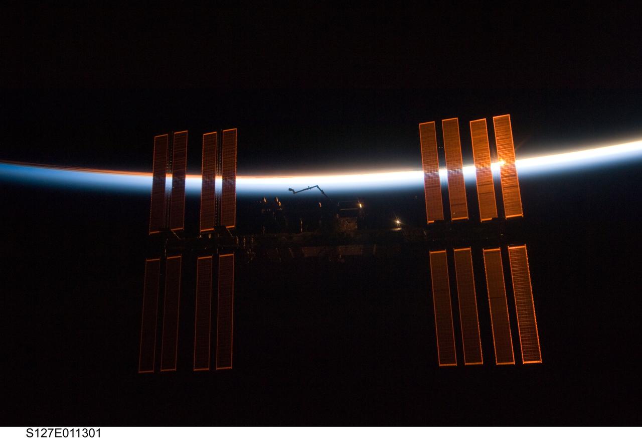S127-E-011301 (28 July 2009) --- Backdropped by the blackness of space and the thin line of Earth's atmosphere, the International Space Station is seen from Space Shuttle Endeavour as the two spacecraft begin their relative separation. Earlier the STS-127 and Expedition 20 crews concluded 11 days of cooperative work onboard the shuttle and station. Undocking of the two spacecraft occurred at 12:26 p.m. (CDT) on July 28, 2009.