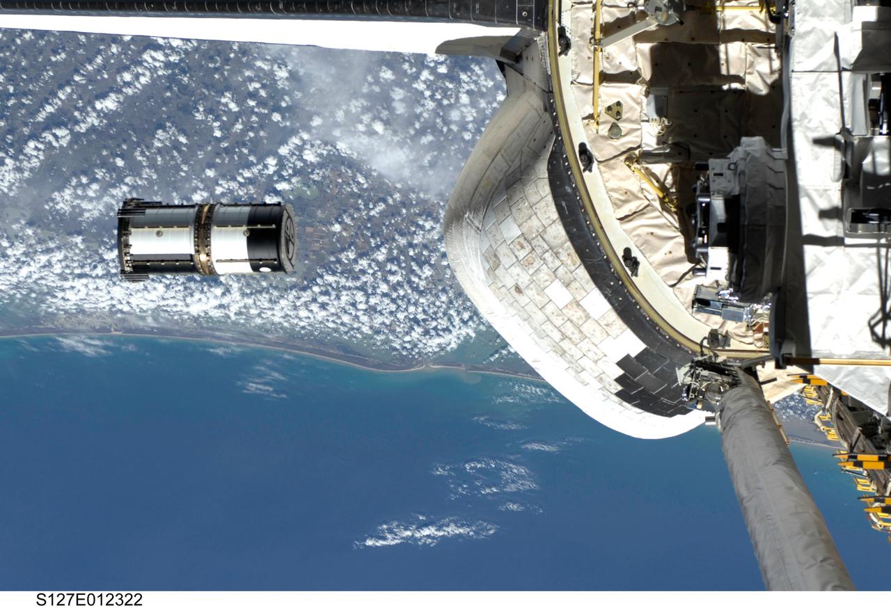 S127-E-012322 (30 July 2009) --- As seen through windows on the aft flight deck of Space Shuttle Endeavour, a Department of Defense pico-satellite known as Atmospheric Neutral Density Experiment 2 (ANDE-2) is released from the shuttle's payload bay by STS-127 crew members. ANDE-2 consists of two spherical micro-satellites which will measure the density and composition of the low-Earth orbit (LEO) atmosphere while being tracked from the ground. The data will be used to better predict the movement of objects in orbit.