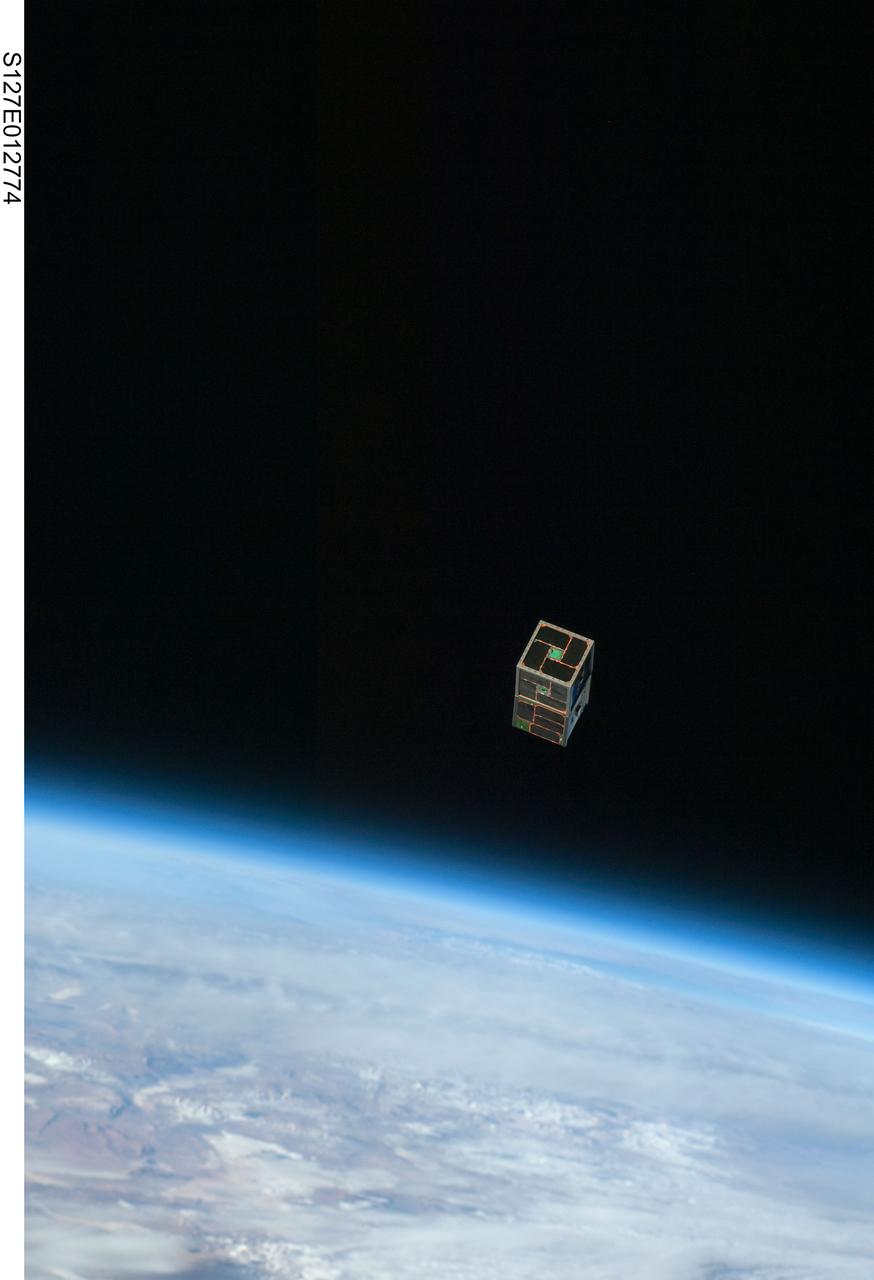S127-E-012774 (30 July 2009) --- Backdropped by Earth?s horizon and the blackness of space, a Dual RF Astrodynamic GPS Orbital Navigator Satellite (DRAGONSat) is photographed after its release from Space Shuttle Endeavour?s payload bay by STS-127 crew members. DRAGONSat will look at independent rendezvous of spacecraft in orbit using Global Positioning Satellite data. The two satellites were designed and built by students at the University of Texas, Austin, and Texas A&M University, College Station.