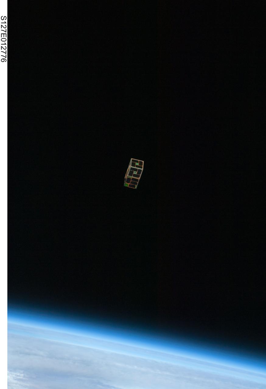 S127-E-012776 (30 July 2009) --- Backdropped by Earth?s horizon and the blackness of space, a Dual RF Astrodynamic GPS Orbital Navigator Satellite (DRAGONSat) is photographed after its release from Space Shuttle Endeavour?s payload bay by STS-127 crew members. DRAGONSat will look at independent rendezvous of spacecraft in orbit using Global Positioning Satellite data. The two satellites were designed and built by students at the University of Texas, Austin, and Texas A&M University, College Station.