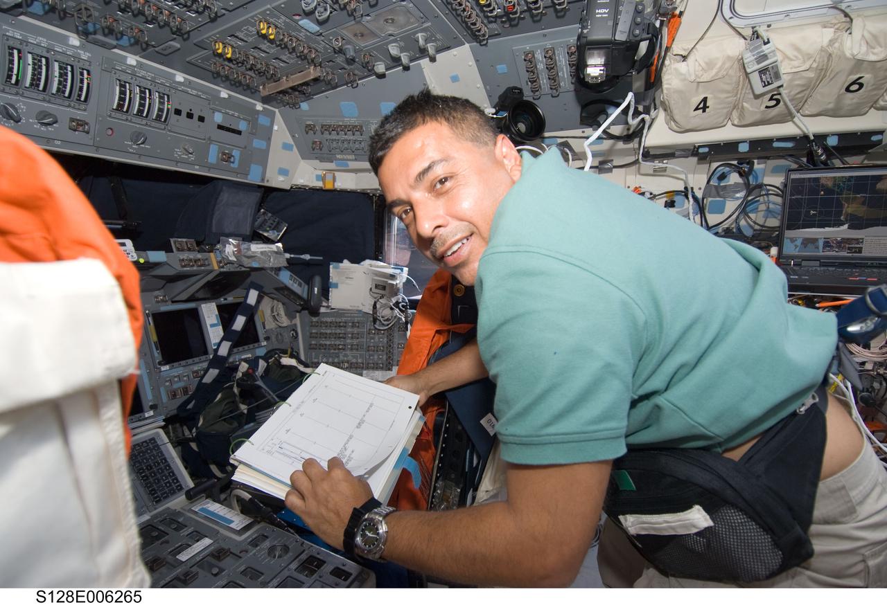 S128-E-006265 (29 Aug. 2009) --- Astronaut Jose Hernandez, STS-128 mission specialist, is pictured on the flight deck of Space Shuttle Discovery during flight day two activities.