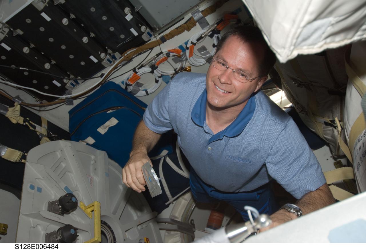 S128-E-006484 (29 Aug. 2009) --- Astronaut Kevin Ford, STS-128 pilot, is pictured on the middeck of the Earth-orbiting Space Shuttle Discovery during flight day two activities.