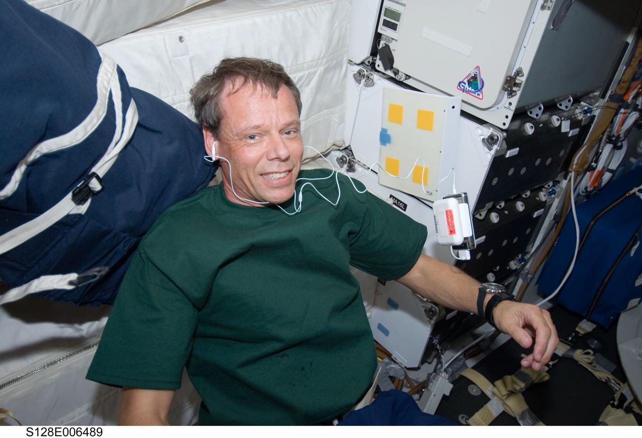 S128-E-006489 (29 Aug. 2009) --- European Space Agency astronaut Christer Fuglesang, STS-128 mission specialist, is pictured on the middeck of the Earth-orbiting Space Shuttle Discovery during flight day two activities.