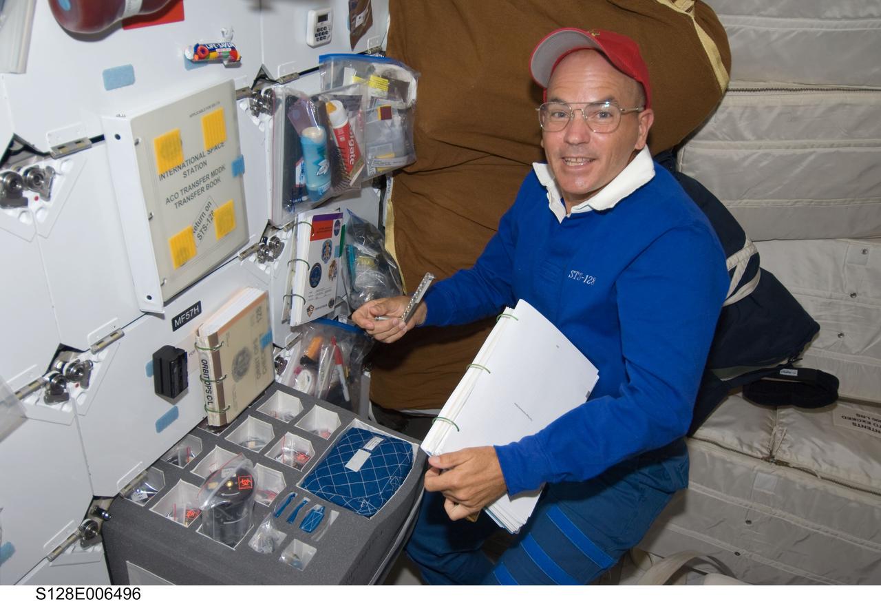 S128-E-006496 (29 Aug. 2009) --- Astronaut Rick Sturckow, STS-128 commander, is pictured on the middeck of the Earth-orbiting Space Shuttle Discovery during flight day two activities.