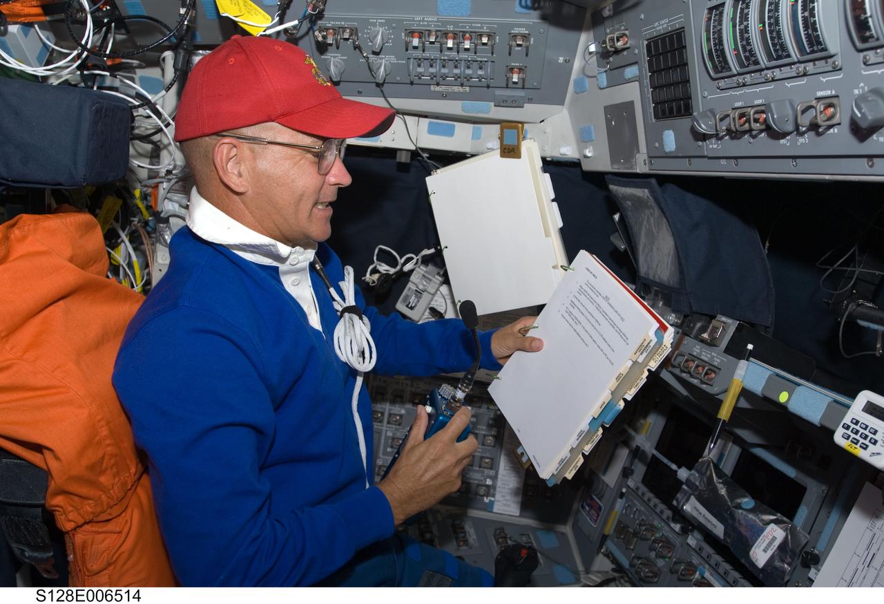 S128-E-006514 (29 Aug. 2009) --- Astronaut Rick Sturckow, STS-128 commander, occupies the commander’s station on the forward flight deck of Space Shuttle Discovery during flight day two activities.