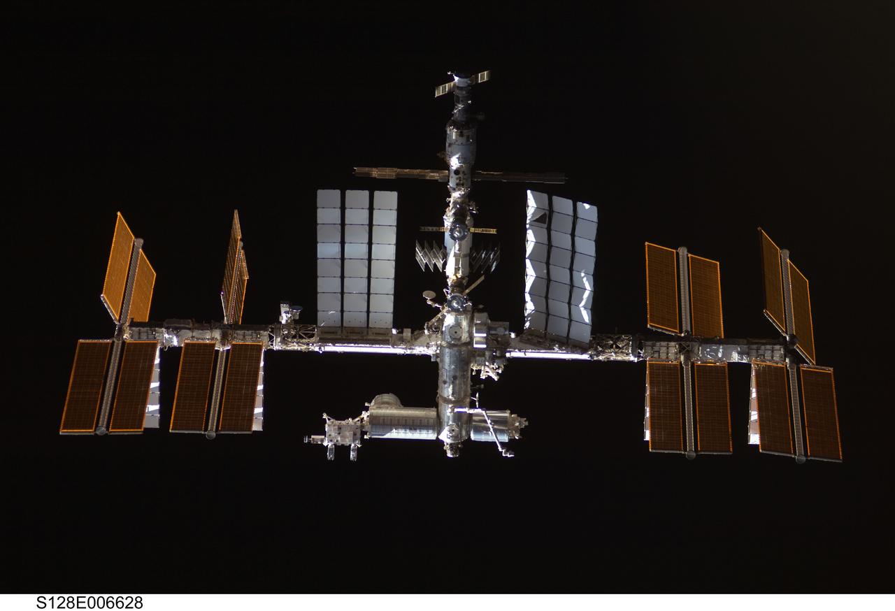 S128-E-006628 (30 Aug. 2009) --- Backdropped by the blackness of space, the International Space Station is featured in this image photographed by an STS-128 crew member as Space Shuttle Discovery and the station approach each other during rendezvous and docking activities on flight day three. Docking occurred at 7:54 p.m. (CDT) on Aug. 30, 2009.