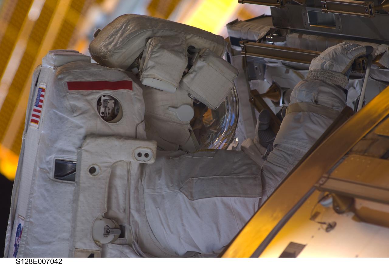 S128-E-007042 (1 Sept. 2009) --- Astronaut John “Danny” Olivas, STS-128 mission specialist, participates in the mission's first session of extravehicular activity (EVA) as construction and maintenance continue on the International Space Station. During the six-hour, 35-minute spacewalk, Olivas and astronaut Nicole Stott (out of frame), mission specialist, removed an empty ammonia tank from the station’s truss and temporarily stowed it on the station’s robotic arm. Olivas and Stott also retrieved the European Technology Exposure Facility (EuTEF) and Materials International Space Station Experiment (MISSE) from the Columbus laboratory module and installed them on Discovery’s payload bay for return.