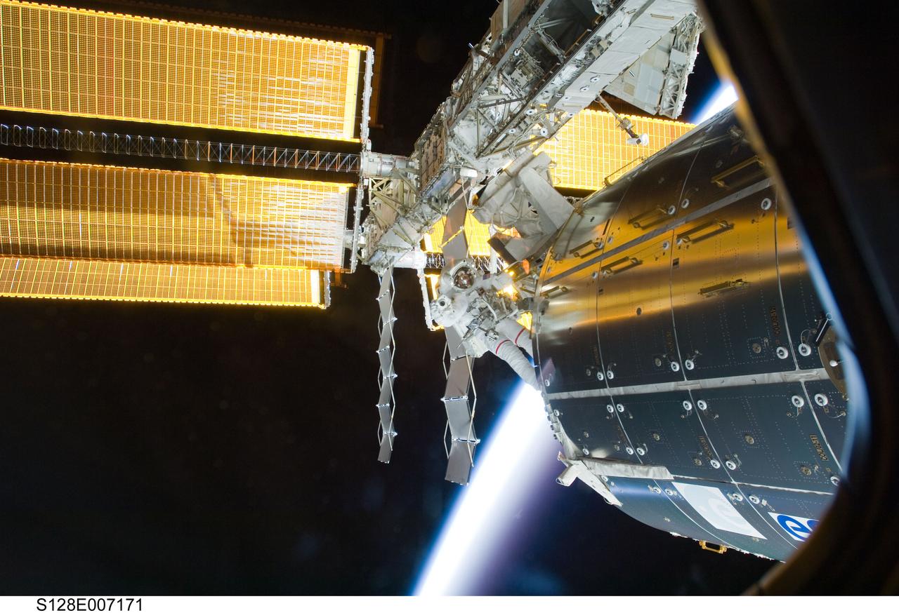 S128-E-007171 (1 Sept. 2009) --- Astronaut John “Danny” Olivas, STS-128 mission specialist, participates in the mission's first session of extravehicular activity (EVA) as construction and maintenance continue on the International Space Station. During the six-hour, 35-minute spacewalk, Olivas and astronaut Nicole Stott (out of frame), mission specialist, removed an empty ammonia tank from the station’s truss and temporarily stowed it on the station’s robotic arm. Olivas and Stott also retrieved the European Technology Exposure Facility (EuTEF) and Materials International Space Station Experiment (MISSE) from the Columbus laboratory module and installed them on Discovery’s payload bay for return. The blackness of space and Earth’s atmosphere provide the backdrop for the scene.