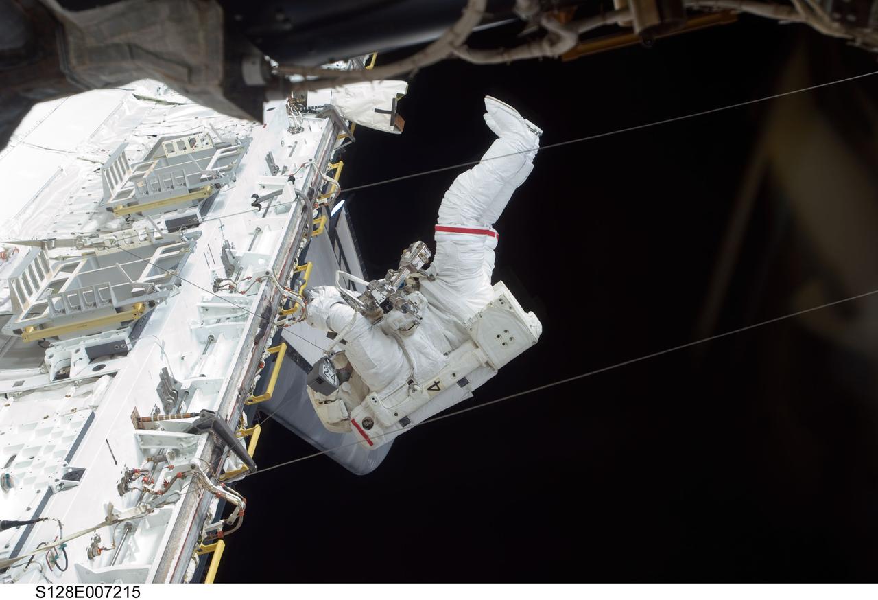S128-E-007215 (1 Sept. 2009) --- Astronaut John “Danny” Olivas, STS-128 mission specialist, participates in the mission's first session of extravehicular activity (EVA) as construction and maintenance continue on the International Space Station. During the six-hour, 35-minute spacewalk, Olivas and astronaut Nicole Stott (out of frame), mission specialist, removed an empty ammonia tank from the station’s truss and temporarily stowed it on the station’s robotic arm. Olivas and Stott also retrieved the European Technology Exposure Facility (EuTEF) and Materials International Space Station Experiment (MISSE) from the Columbus laboratory module and installed them on Discovery’s payload bay for return.