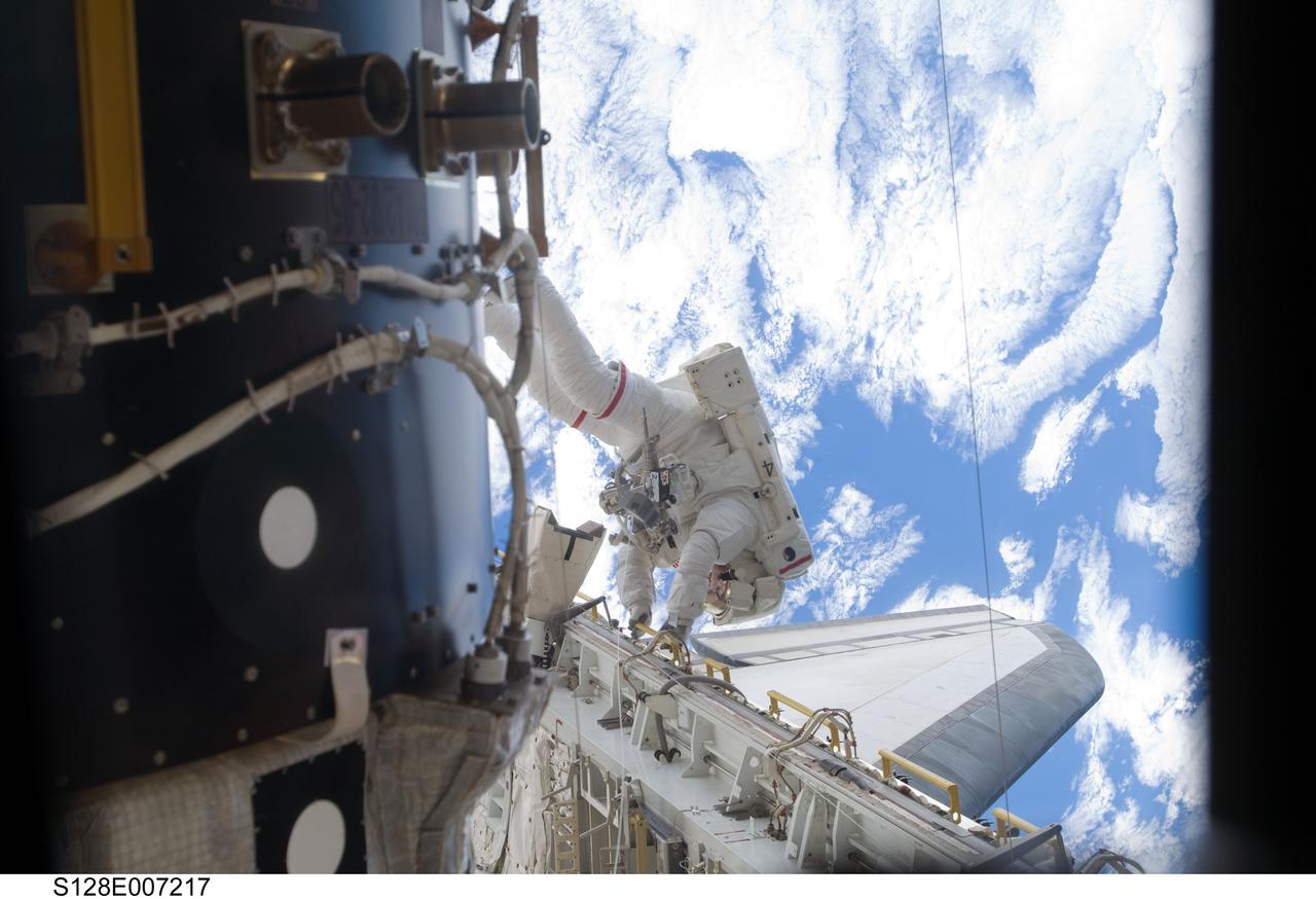 S128-E-007217 (1 Sept. 2009) --- Astronaut John “Danny” Olivas, STS-128 mission specialist, participates in the mission's first session of extravehicular activity (EVA) as construction and maintenance continue on the International Space Station. During the six-hour, 35-minute spacewalk, Olivas and astronaut Nicole Stott (out of frame), mission specialist, removed an empty ammonia tank from the station’s truss and temporarily stowed it on the station’s robotic arm. Olivas and Stott also retrieved the European Technology Exposure Facility (EuTEF) and Materials International Space Station Experiment (MISSE) from the Columbus laboratory module and installed them on Discovery’s payload bay for return.
