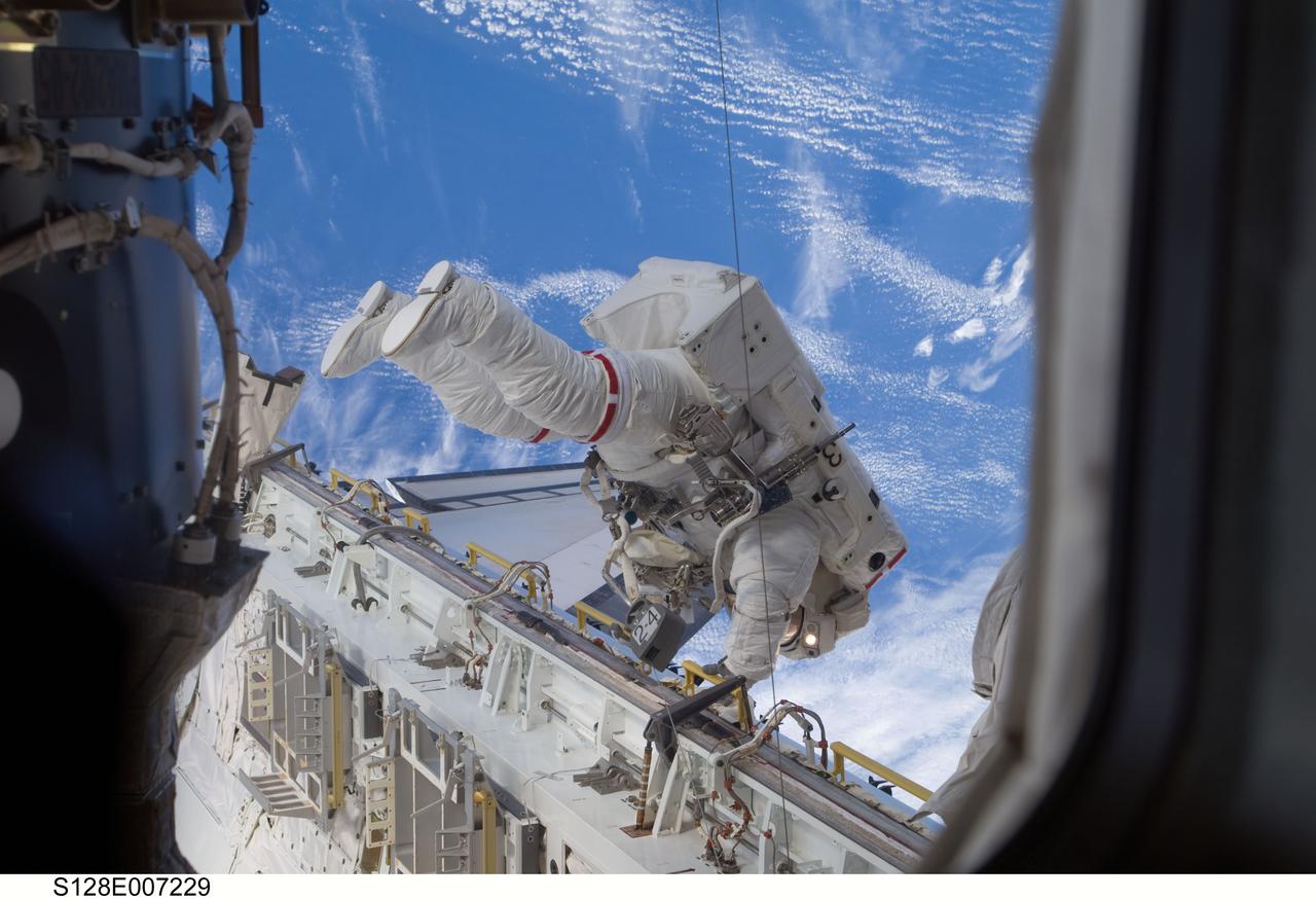 S128-E-007229 (1 Sept. 2009) --- Astronaut Nicole Stott, Expedition 20 flight engineer, participates in the STS-128 mission's first session of extravehicular activity (EVA) as construction and maintenance continue on the International Space Station. During the six-hour, 35-minute spacewalk, Stott and astronaut John “Danny” Olivas (out of frame), mission specialist, removed an empty ammonia tank from the station’s truss and temporarily stowed it on the station’s robotic arm. Olivas and Stott also retrieved the European Technology Exposure Facility (EuTEF) and Materials International Space Station Experiment (MISSE) from the Columbus laboratory module and installed them on Discovery’s payload bay for return.