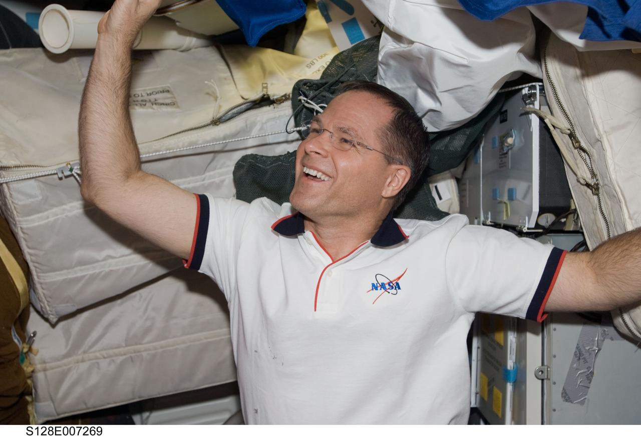 S128-E-007269 (4 Sept. 2009) --- As the STS-128 crew and the Shuttle Discovery half just passed the half way point of their mission, the countenance of astronaut Kevin Ford, pilot, shows his pleasure with the way things are going. At this point, from inside the shuttle and station, Ford and his crewmates have supported two of three spacewalks, with the final one scheduled for Sept. 5. Aside from the spacewalks, a long list of tasks has been performed by the aggregation of 13 astronauts and cosmonauts sharing space on the two spacecraft for several days.