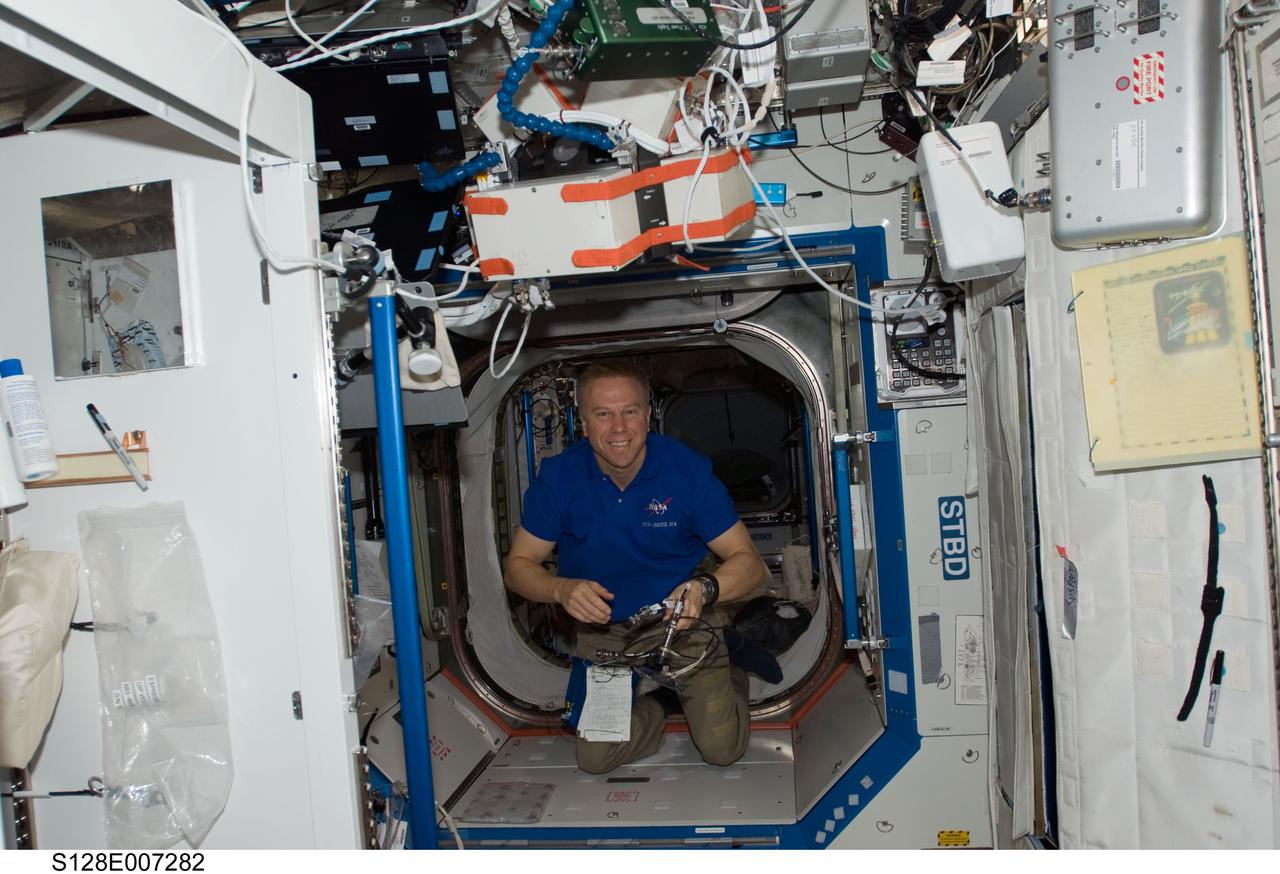 S128-E-007282 (4 Sept. 2009) --- Onboard the International Space Station since July, astronaut Tim Kopra is pictured on the orbital outpost a little less than a week before his scheduled return to Earth. Earlier this week, Kopra changed roles from Expedition 20 flight engineer to STS-128 mission specialist. Kopra came up to the station with the STS-127 crew and participated in a spacewalk on July 18. He will return to Earth aboard the Discovery on a scheduled Sept. 10 landing.