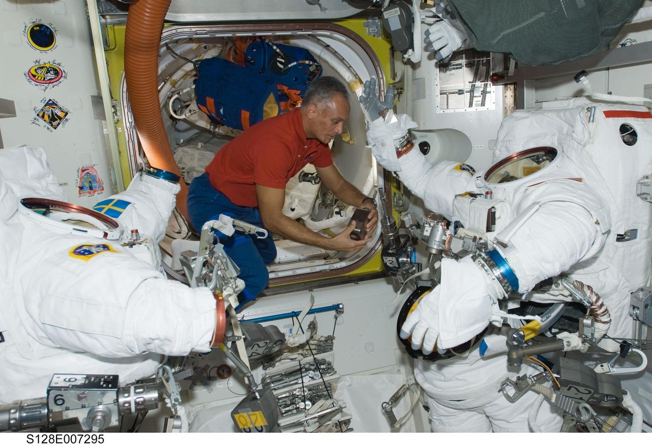 S128-E-007295 (4 Sept. 2009) --- Astronaut John “Danny” Olivas, STS-128 mission specialist, has spent a good portion of his current mission  in space either in the airlock, as in this case, or wearing one of the pictured extravehicular mobility unit (EMU) spacesuits doing work outside the International Space Station. His final of three scheduled sessions of extravehicular activity (EVA) is set for Sept. 5.