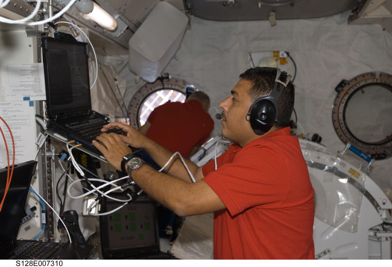 S128-E-007310 (4 Sept. 2009) ---- Astronaut José Hernandez, STS-128 mission specialist, is busy at a work station in the Japan Aerospace Exploration Agency's Kibo laboratory onboard the International Space Station during flight day 8 for the Discovery astronauts, currently working with the Expedition 20 crewmembers aboard the orbital outpost.