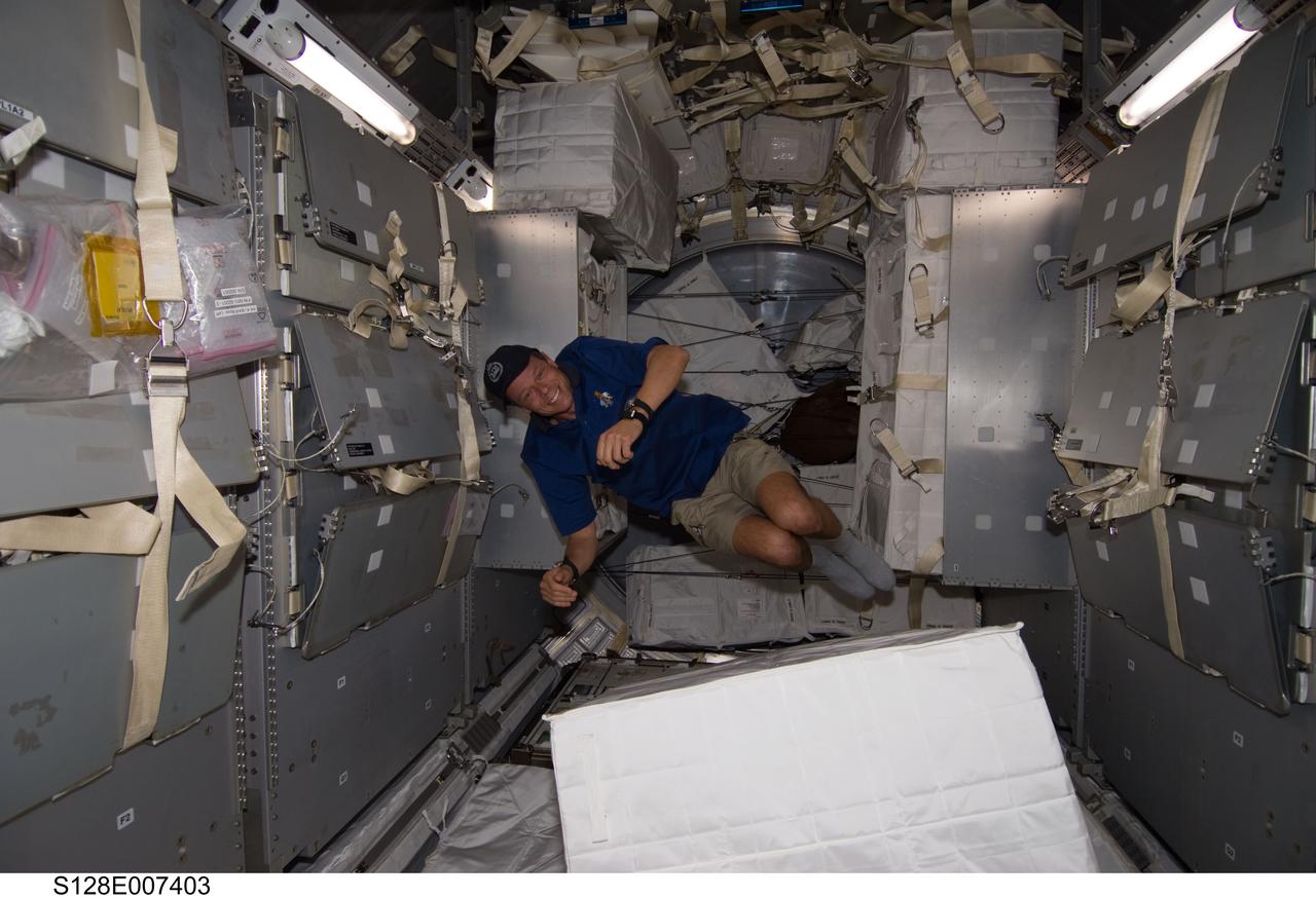S128-E-007403 (1 Sept. 2009) --- European Space Agency astronaut Christer Fuglesang, STS-128 mission specialist, is pictured floating freely in the Leonardo Multi-Purpose Logistics Module (MPLM), temporarily attached to the International Space Station while Space Shuttle Discovery remains docked with the station.