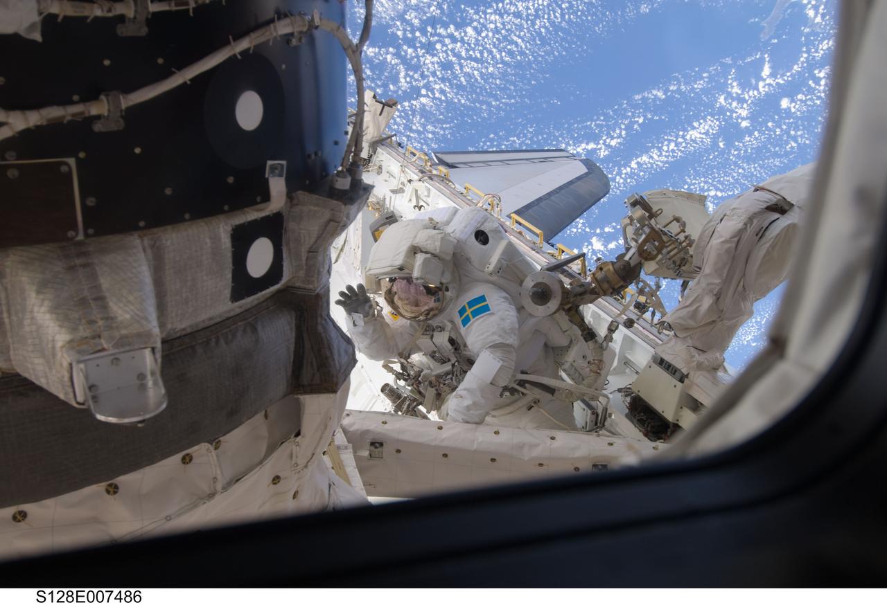 S128-E-007486 (3 Sept. 2009) --- European Space Agency astronaut Christer Fuglesang, STS-128 mission specialist, participates in the mission's second session of extravehicular activity (EVA) as construction and maintenance continue on the International Space Station. During the six-hour, 39-minute spacewalk, Fuglesang and NASA astronaut John “Danny” Olivas (out of frame), mission specialist, installed the new Ammonia Tank Assembly on the Port 1 Truss and stowed the empty tank assembly into the Space Shuttle Discovery’s cargo bay.